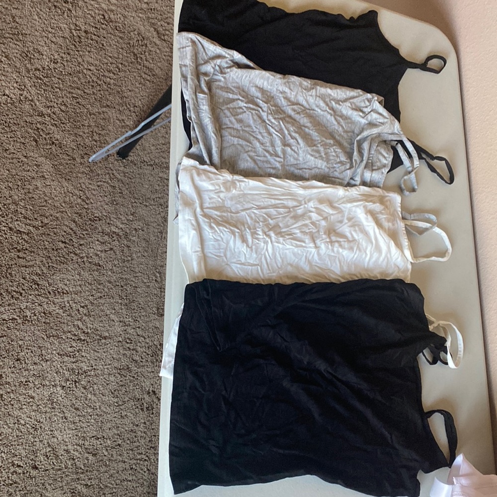 Pack of 4 tank tops. Size M. Never worn.